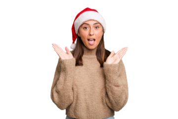Young caucasian woman celebrating christmas wearing a santa hat isolated surprised and shocked.