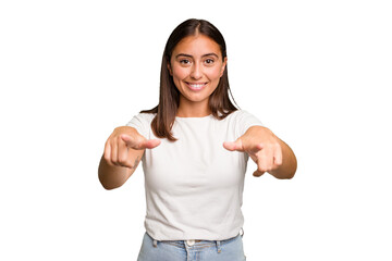 Young cute caucasian woman isolated cheerful smiles pointing to front.