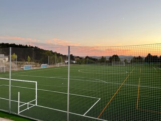 Soccer field background with a shallow depth of field on a beautiful summer day