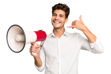 Young caucasian man holding megaphone isolated showing a mobile phone call gesture with fingers.
