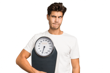 Young caucasian man holding a scale isolated confused, feels doubtful and unsure.