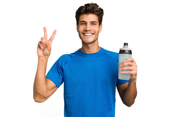 Young sport caucasian man holding a bottle of water isolated showing number two with fingers.