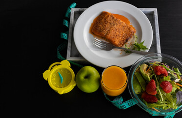 Yellow alarm clock with IF (Intermittent Fasting) 16 and 8 diet rule and weight loss concept.