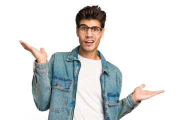 Young caucasian handsome man isolated confused and doubtful shrugging shoulders to hold a copy space.