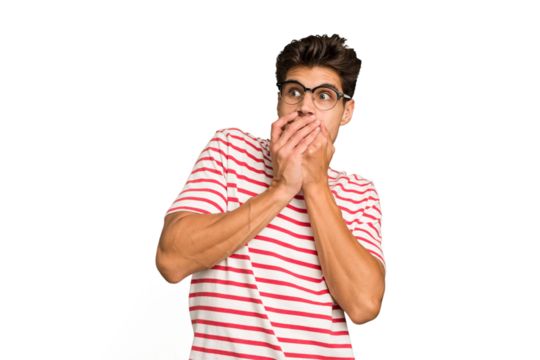 Young caucasian handsome man isolated thoughtful looking to a copy space covering mouth with hand.