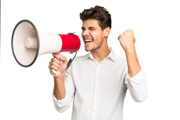 Young caucasian man screaming with a megaphone isolated