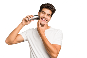 Young caucasian man shaving his beard with a razor isolated