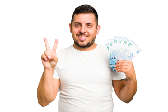 Young caucasian man holding a banknotes isolated showing number two with fingers.