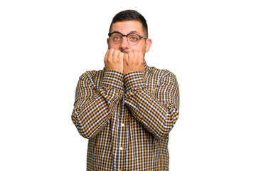 Young caucasian man isolated biting fingernails, nervous and very anxious.