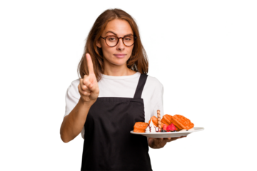 Young caucasian woman holding a waffles dish isolated showing number one with finger.