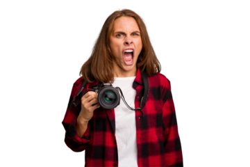 Young photographer caucasian woman isolated screaming very angry and aggressive.