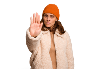 Young caucasian woman wearing winter clothes isolated standing with outstretched hand showing stop sign, preventing you.