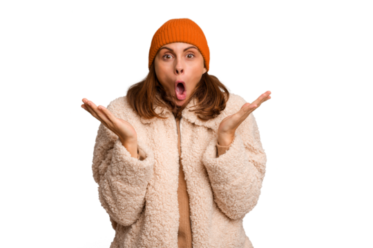 Young caucasian woman wearing winter clothes isolated surprised and shocked.
