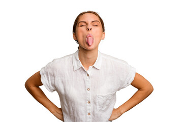 Young caucasian woman isolated funny and friendly sticking out tongue.