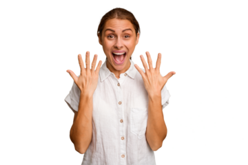 Young caucasian woman isolated showing number ten with hands.