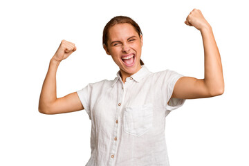 Fototapeta premium Young caucasian woman isolated cheering carefree and excited. Victory concept.