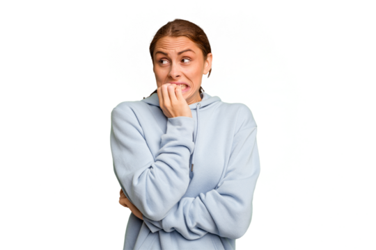 Young caucasian woman isolated biting fingernails, nervous and very anxious.