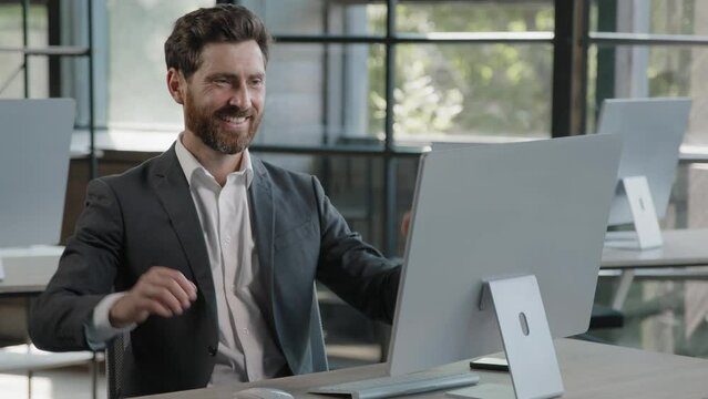 Caucasian businessman working with computer in office bearded man boss worker manager finish online project startup work day off has break relax satisfied leans back on chair holding hands behind head