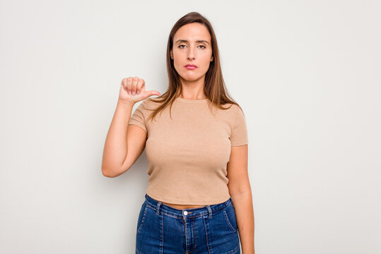 Young caucasian cute woman isolated on white background showing a dislike gesture, thumbs down. Disagreement concept.