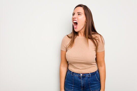 Young Caucasian Cute Woman Isolated On White Background Shouting Very Angry, Rage Concept, Frustrated.