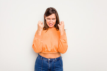 Young caucasian cute woman isolated on white background upset screaming with tense hands.