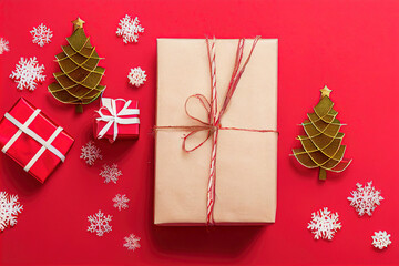 christmas gifts on a red background with packages and decorative pieces of christmas motifs