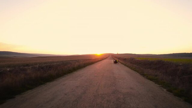 Aerial view of an Adaptive athlete doing a training ride on his handcycle. High quality 4k footage