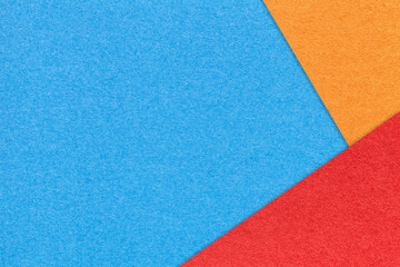 Fototapeta premium Texture of craft blue color paper background with red and orange border. Turquoise cardboard. Presentation template