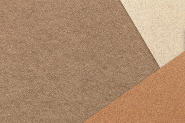 Texture of craft umber color paper background with beige and brown border. Vintage abstract cardboard.