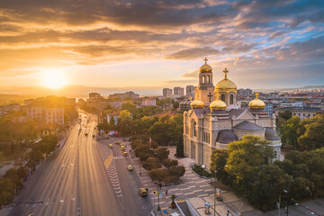 Fototapeta na wymiar The Cathedral of the Assumption in Varna, Bulgaria. Aerial sunset cityscape view