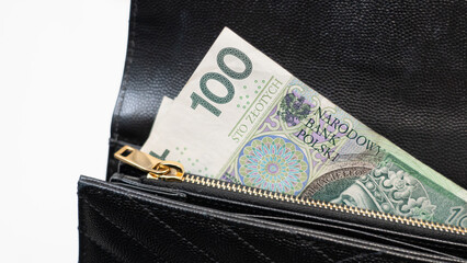 Polish money in a black wallet, holding money in a wallet, 100 polish note, Poland’s legal...