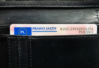 driving permit. Prawo jazdy portfel, Polish driving license in a black wallet. Polish and european union emblem. Driver's license in Poland in a leather wallet - obrazy, fototapety, plakaty