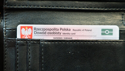 Dowód osobisty, Polish ID card (Identity Card) in black wallet. Polish emblem eagle on a red background. National identity card in Poland - obrazy, fototapety, plakaty