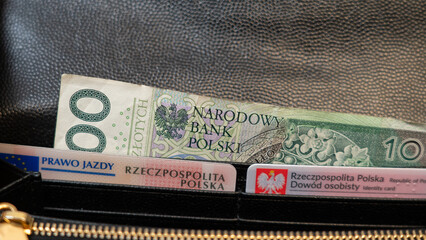 Pieniądze, , złotówki, Polish ID card (Identity Card), driving license 100PLN note in a black wallet. Polish emblem eagle  National identity card, driver's license in Poland and polish cash (money)