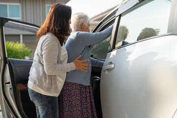 Asian senior or elderly old lady woman patient sitting on wheelchair prepare get to her car,...