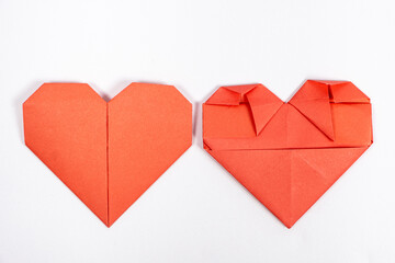 Obraz premium Origami for Valentine's Day - heart made of paper on a white background do it yourself