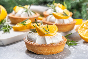 Christmas dessert, Lemon rosemary tartlets, mini tart cakes copy space