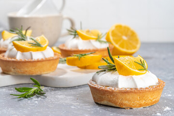 Christmas dessert, Lemon rosemary tartlets, mini tart cakes copy space