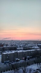 Pink sunset from above the city.