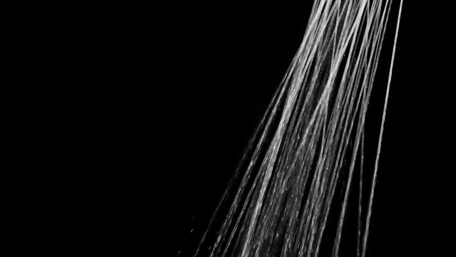 Water flows from the shower on a black background. Overlay template.