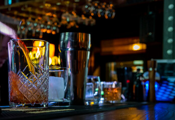 woman hand bartender making negroni cocktail in bar