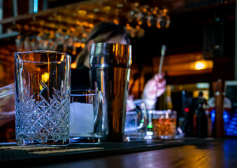 woman hand bartender making negroni cocktail in bar