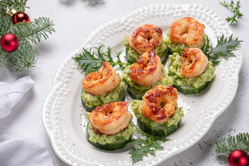Cucumber Avocado Shrimp Appetizer. Canape with prawn, cucumber and guacamole, party food, finger...