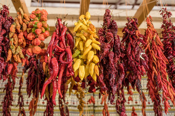 orange, yellow and red chili peppers at covered market, Funchal, Madeira
