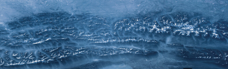 Aerial view of mountain landscape. Cascade mountain. Winter background. Earth landscape view in winter. Earth observatory from satellite. Elements of this image furnished by NASA