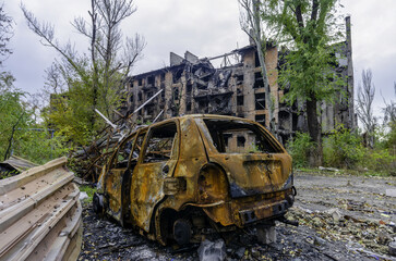 damaged and looted cars in a city in Ukraine during the war