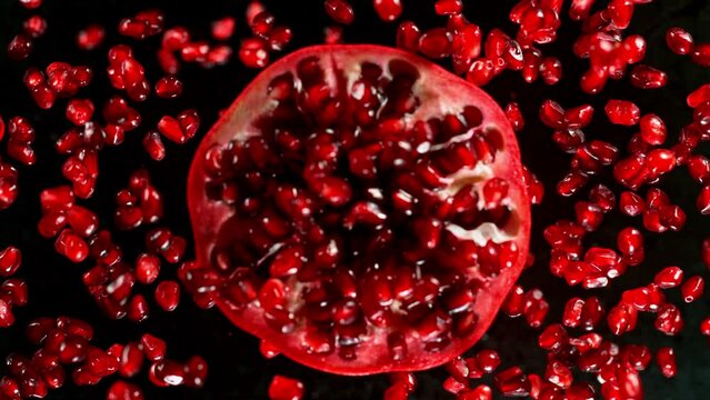 Fresh sliced pomegranate flying, super slow motion filmed on high speed cinematic camera at 1000 fps