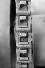 old rusty chain on a mechanical engine in a black and white monochrome
