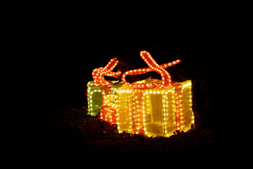 Christmas presents made of glass with lighting as outdoor decoration at Christmas.