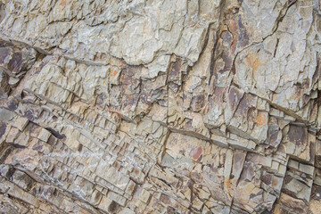 natural limestone protrudes from the rock in layers